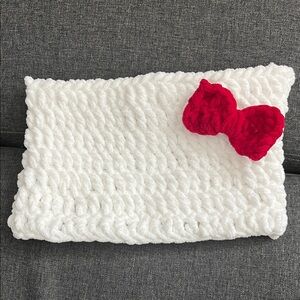 Crochet beanie with red bow